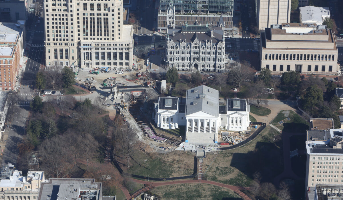 Aerial view of Virginia State Capitol amid offices and lawns.