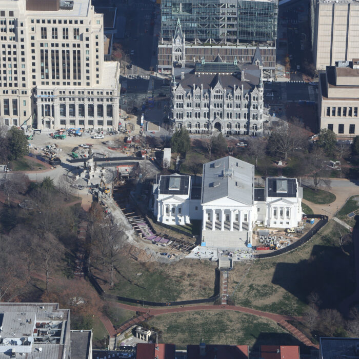 Aerial view of Virginia State Capitol amid offices and lawns.