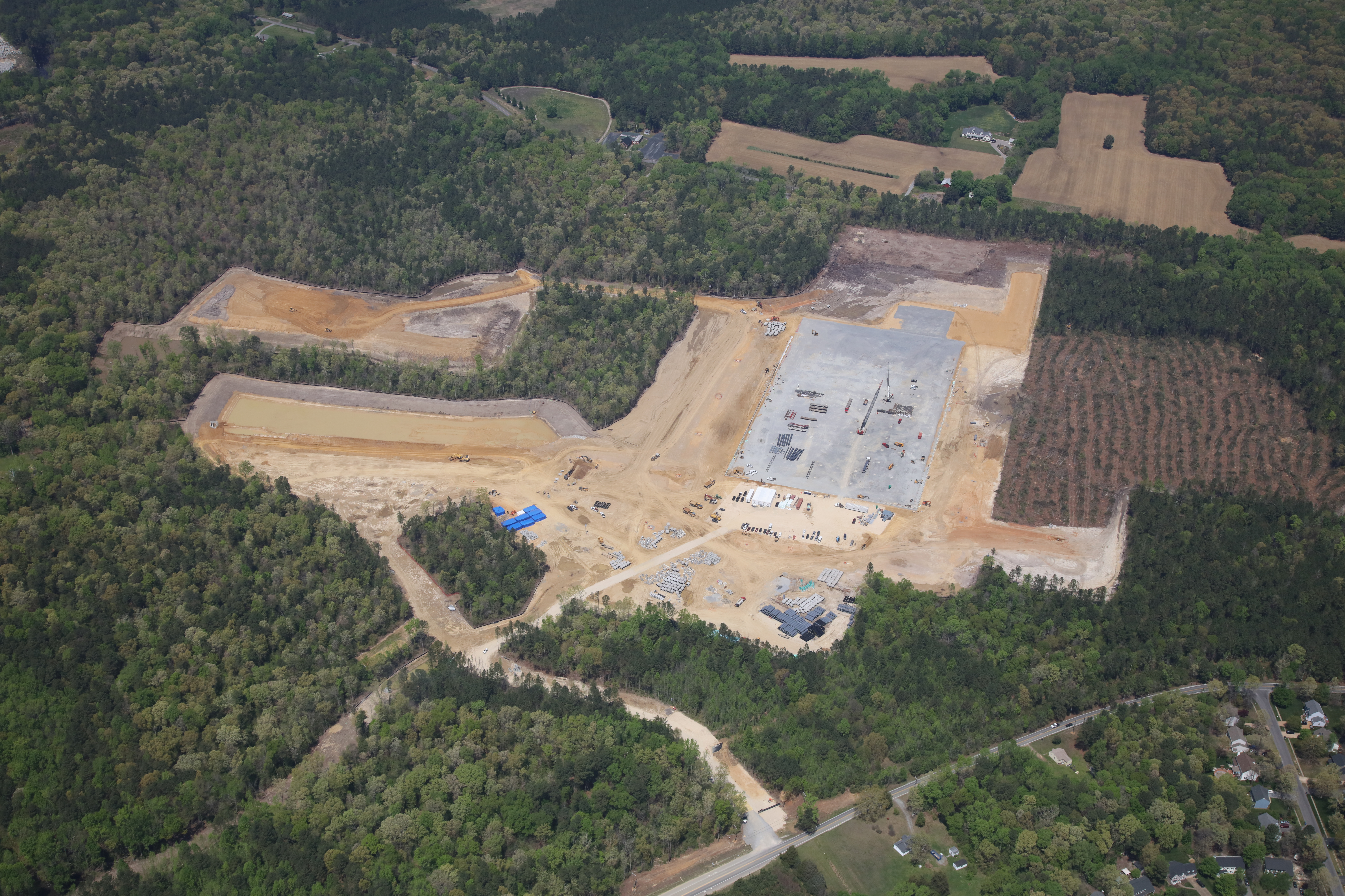 Aerial photo of construction site that will house a large distribution center; foundation visible.
