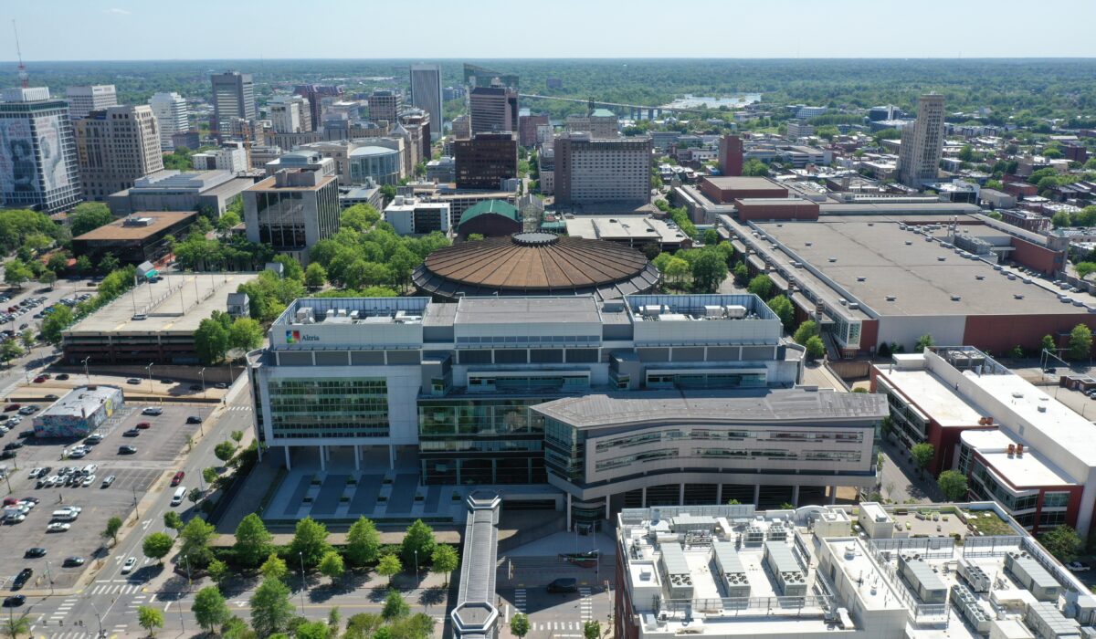 Aerial view of downtown arena, office buildings, and roads.