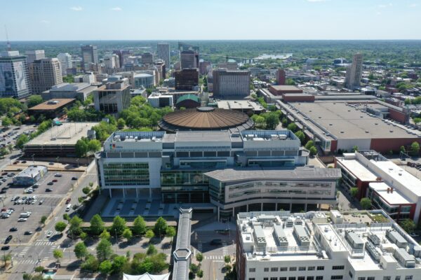 Aerial view of downtown arena, office buildings, and roads.