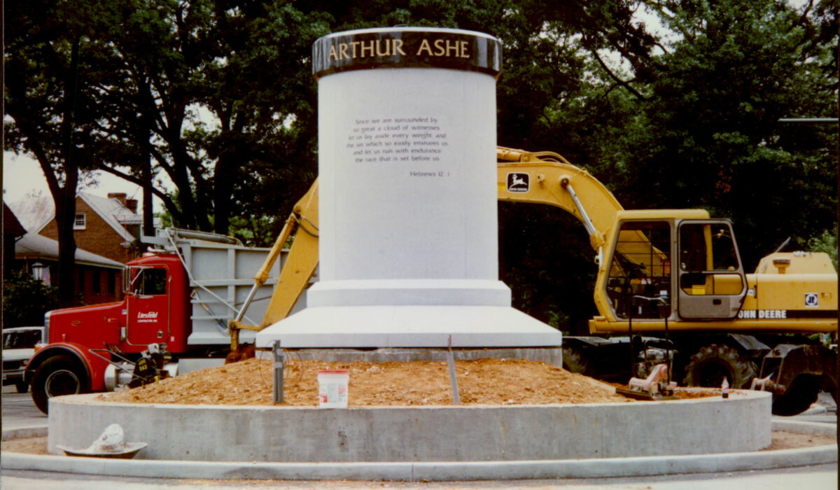 Arthur Ashe pedestal under construction, Hebrews 12:1 quote visible.