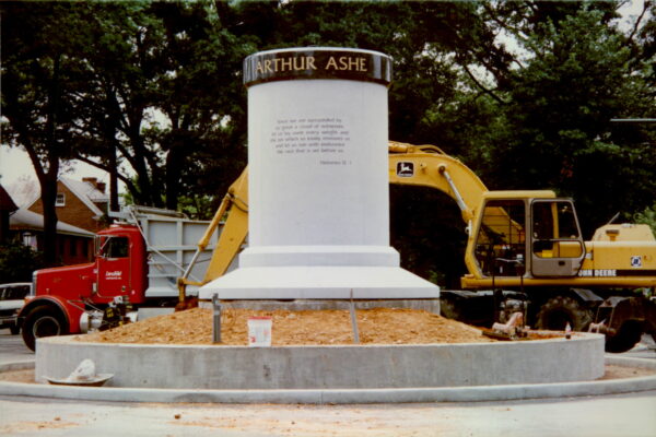 Arthur Ashe pedestal under construction, Hebrews 12:1 quote visible.